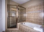 Master bathroom, full size large, deep tub, walk in glass, with pebble shower flooring with glass walls. Powder room with privacy. Double vanity with perfect lighting. 